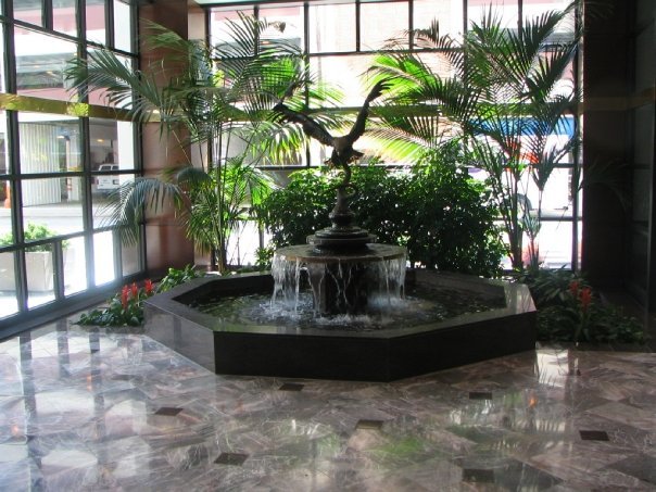 water fountain with plants and marble floor